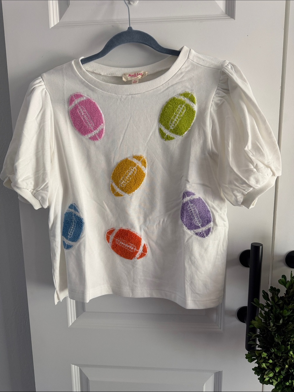 Peach Love California  White Puff-Sleeve Tee with Multicolor Football Motifs